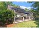 Charming backyard deck with an umbrella covered dining and lounge area at 5908 Danville Dr, Raleigh, NC 27612