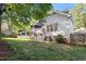 Cozy backyard with a charming deck and manicured lawn and garden space at 5908 Danville Dr, Raleigh, NC 27612
