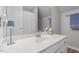 Bright bathroom featuring a white vanity, oval sink, and modern faucet at 5908 Danville Dr, Raleigh, NC 27612