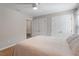 Comfortable bedroom features ample closet space, a ceiling fan, and neutral decor at 5908 Danville Dr, Raleigh, NC 27612