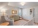 Comfortable Bedroom features a changing table, soft rug, and white closet doors at 5908 Danville Dr, Raleigh, NC 27612
