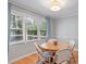 Bright breakfast nook featuring natural light, a round wooden table, and seating for four at 5908 Danville Dr, Raleigh, NC 27612