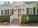 Charming two-story home featuring a brick walkway, beautiful landscaping, and a classic architectural design at 5908 Danville Dr, Raleigh, NC 27612