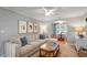 Bright living room featuring neutral walls, stylish furnishings, and a connecting dining area at 5908 Danville Dr, Raleigh, NC 27612