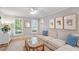 Cozy living room featuring neutral walls, stylish furnishings, and a view of a brick fireplace at 5908 Danville Dr, Raleigh, NC 27612