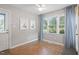 Bright sunroom with tile floors, a ceiling fan, and natural light; has access to the backyard at 5908 Danville Dr, Raleigh, NC 27612