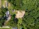 Aerial view of the property showcasing its location amidst lush greenery and surrounding landscape at 6005 Lake Wheeler Rd, Raleigh, NC 27603