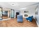 Wide angle of the living room with fireplace, laminate floors and sliding barn door at 6005 Lake Wheeler Rd, Raleigh, NC 27603