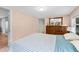 Inviting bedroom with a neutral color palette, dresser, and hardwood floors at 6005 Lake Wheeler Rd, Raleigh, NC 27603