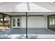 Covered carport area with access to the home's entrance and ample parking space at 6005 Lake Wheeler Rd, Raleigh, NC 27603