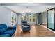 Bright living room features wood floors, ample natural light, and a sliding barn door at 6005 Lake Wheeler Rd, Raleigh, NC 27603