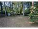 Backyard featuring a horseshoe pit and a shed along the rear fence line at 609 Sloan Dr, Cary, NC 27511