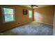 Bedroom with neutral paint and carpet, two windows for natural light and ceiling fan at 609 Sloan Dr, Cary, NC 27511