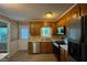 Cozy kitchen featuring stainless steel appliances, wood cabinets and lots of natural light at 609 Sloan Dr, Cary, NC 27511