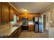 Cozy kitchen featuring stainless steel appliances, wood cabinets and lots of natural light at 609 Sloan Dr, Cary, NC 27511