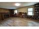 Spacious living room featuring a fireplace and built-in bookcases beneath the windows at 609 Sloan Dr, Cary, NC 27511