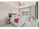 Bright bedroom with a large window, ceiling fan, and neutral decor at 610 Callan View Ave, Wake Forest, NC 27587