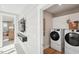 Convenient laundry room with modern washer and dryer and storage cabinets at 610 Callan View Ave, Wake Forest, NC 27587