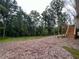 Spacious backyard with wooded views, a deck, and plenty of privacy at 620 Rollins Mill Rd, Holly Springs, NC 27540