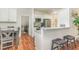 Beautiful kitchen features granite countertops, stainless steel appliances, and an adjacent dining area at 620 Rollins Mill Rd, Holly Springs, NC 27540