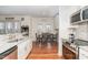 Bright eat-in kitchen features stainless appliances and stylish granite countertops at 620 Rollins Mill Rd, Holly Springs, NC 27540