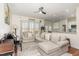 Open-concept living room features a comfortable sofa and connection to the kitchen at 620 Rollins Mill Rd, Holly Springs, NC 27540