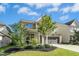 Well-maintained two-story home with lush landscaping and a two-car garage at 634 Stapleford Ln, Fuquay Varina, NC 27526