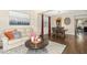 Open-concept living room and dining room with modern decor, hardwood floors, and lots of natural light at 634 Stapleford Ln, Fuquay Varina, NC 27526