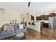 Comfortable living room showcasing hardwood floors and open concept design to the kitchen at 634 Stapleford Ln, Fuquay Varina, NC 27526