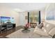 Inviting living room with hardwood floors, neutral paint, lots of natural light, and a comfortable sofa at 634 Stapleford Ln, Fuquay Varina, NC 27526