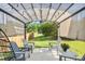 Charming covered patio featuring comfortable seating and string lights, perfect for outdoor relaxation at 634 Stapleford Ln, Fuquay Varina, NC 27526