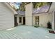 Spacious painted back deck with access to the backyard and white brick exterior at 701 Bennington Dr, Raleigh, NC 27615