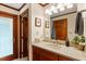 Bathroom vanity, with a wood door entrance at 701 Bennington Dr, Raleigh, NC 27615