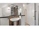 Charming bathroom featuring a pedestal sink, a mirror, and a shower with glass door at 701 Bennington Dr, Raleigh, NC 27615