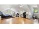 Large bedroom with wood floors, a bed, a desk, and windows at 701 Bennington Dr, Raleigh, NC 27615