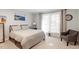 Bright bedroom with neutral tones, carpeted floors, and plenty of natural light, creating a relaxing retreat at 701 Bennington Dr, Raleigh, NC 27615