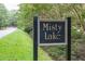 A formal community sign identifying the neighborhood as Misty Lake at 701 Bennington Dr, Raleigh, NC 27615