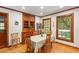 Charming dining room with hardwood floors, natural light, and classic wooden furnishings, perfect for Gathering meals at 701 Bennington Dr, Raleigh, NC 27615