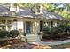 Close up of a traditional home featuring a blue front door and well-maintained landscaping at 701 Bennington Dr, Raleigh, NC 27615