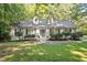 Charming home featuring a landscaped front yard and a classic architectural design at 701 Bennington Dr, Raleigh, NC 27615