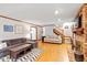 Inviting living room with hardwood floors, a brick fireplace, and neutral-toned sofas for a comfortable gathering space at 701 Bennington Dr, Raleigh, NC 27615