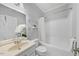 Clean bathroom featuring a single sink vanity, glass shelves and a shower-tub combo at 745 Oaks Lane Rd, Timberlake, NC 27583