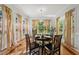 Dining area with wood floors, natural light, and seating for six at 745 Oaks Lane Rd, Timberlake, NC 27583