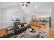 Spacious living room featuring hardwood floors open to a kitchen area at 745 Oaks Lane Rd, Timberlake, NC 27583