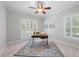 Home office features natural light, neutral walls, and a stylish area rug at 745 Oaks Lane Rd, Timberlake, NC 27583