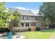 Spacious backyard with a deck and mature trees, perfect for outdoor living at 7801 Kingsbrook Ct, Wake Forest, NC 27587