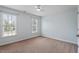 Bright bedroom with neutral carpet and light blue walls, providing lots of natural light at 7801 Kingsbrook Ct, Wake Forest, NC 27587