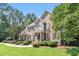 Beautiful brick home with a well-kept lawn and lush landscaping at 7801 Kingsbrook Ct, Wake Forest, NC 27587