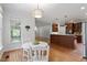 Eat-in kitchen with island, stainless steel appliances, and custom cabinetry at 7801 Kingsbrook Ct, Wake Forest, NC 27587