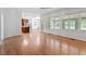 Spacious living room with hardwood floors and sunroom access at 7801 Kingsbrook Ct, Wake Forest, NC 27587